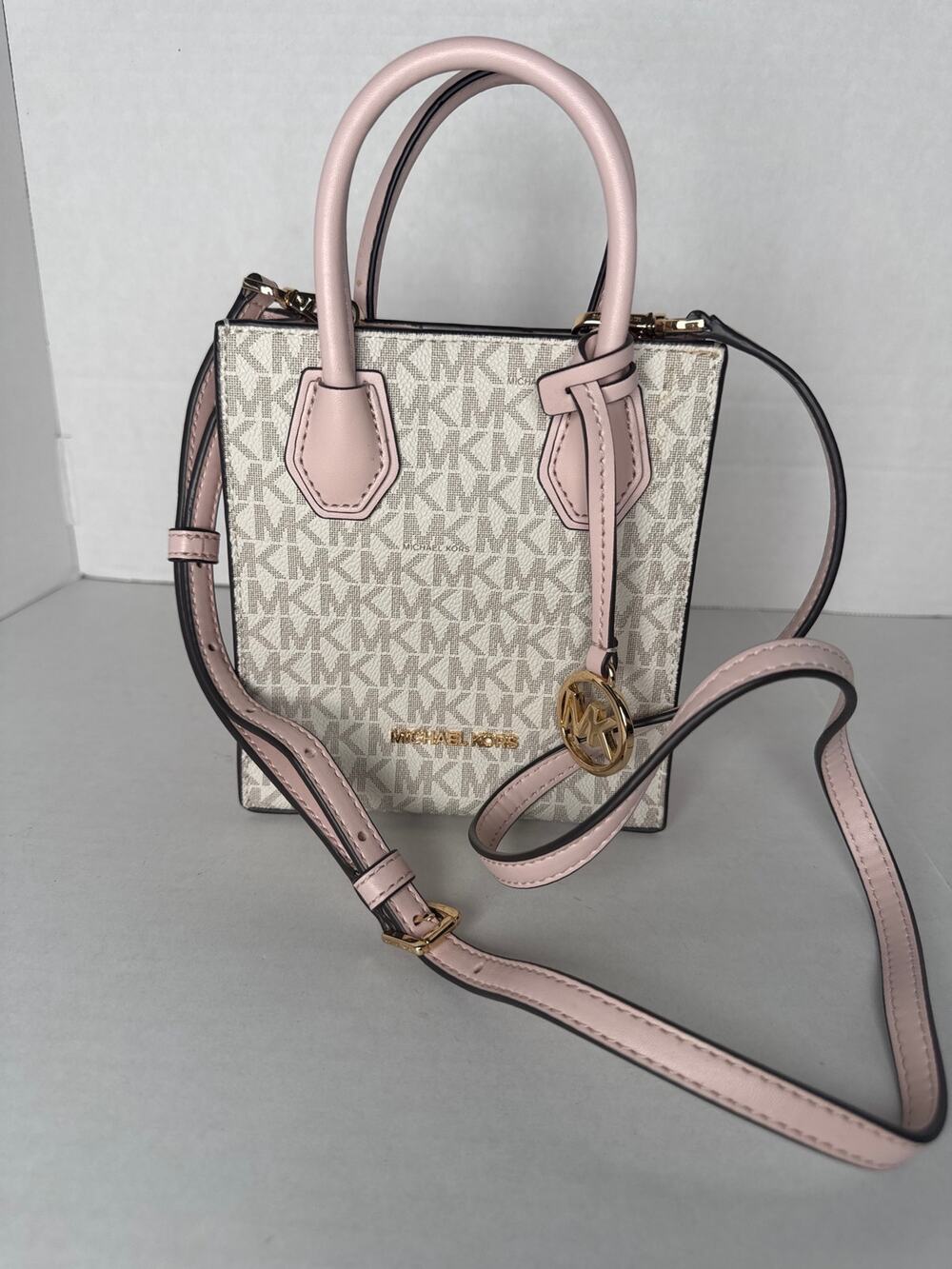 Michael Kors Mercer Extra-Small Signature Logo Crossbody Bag white and pink